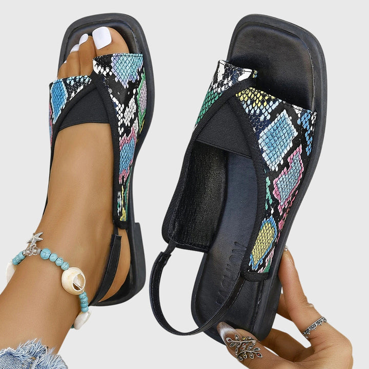 Supportive women's orthopedic sandals providing ultimate comfort & foot relief for summer beach activities.