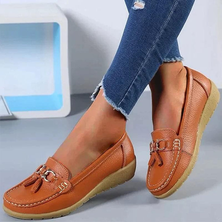 Woman's feet wearing versatile slip-on orthopedic loafers, perfect for comfortable casual or everyday activities.