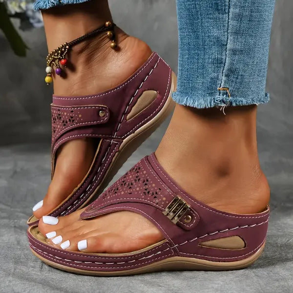 Stylish women's orthopedic wedge sandals with laser cut design, adjustable strap, and cushioned foot support.