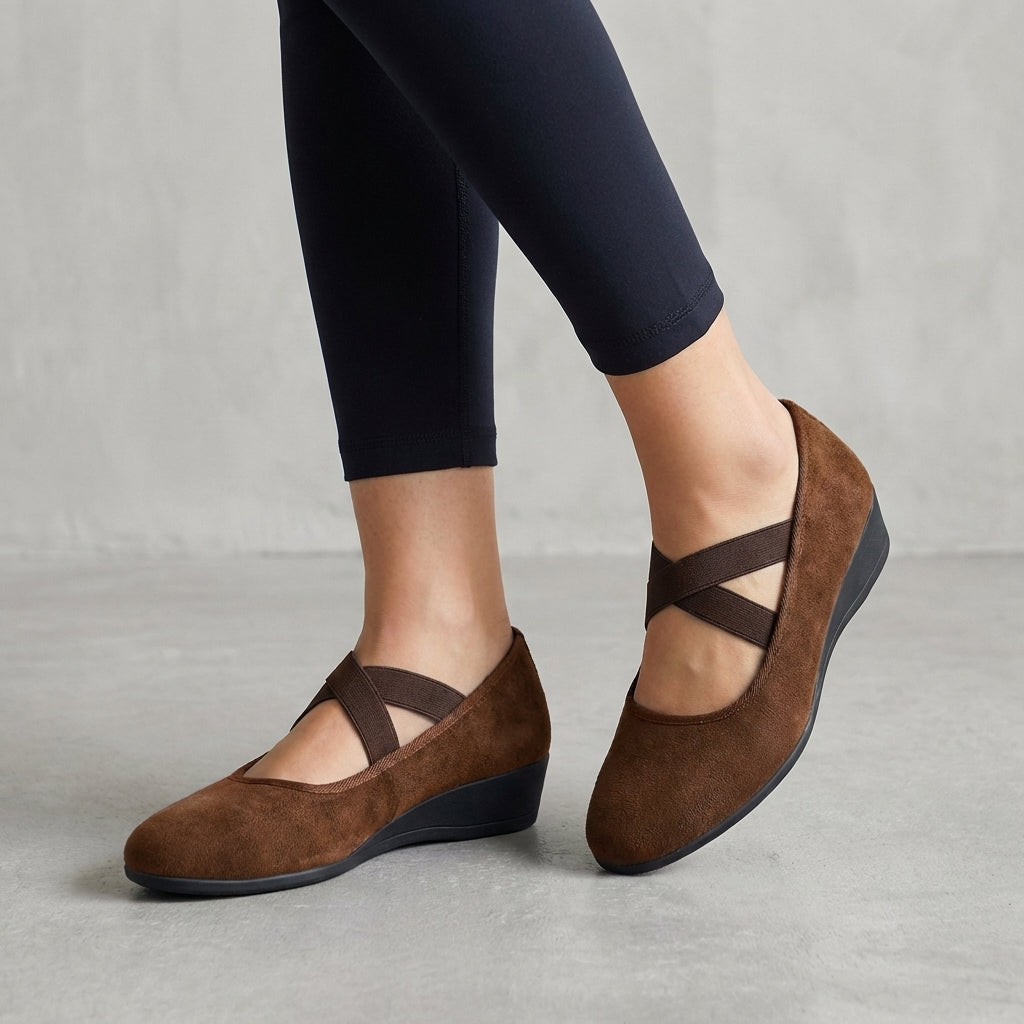 Elegant women's orthopedic wedge flats with criss-cross straps, offering modern style & excellent support.