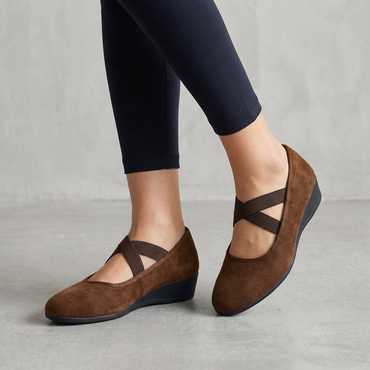 Elegant women's orthopedic wedge flats with criss-cross straps, offering modern style & excellent support.