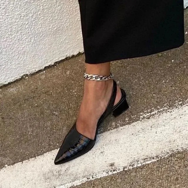 Elegant women's croco embossed pointed toe slingback heels. Stylish comfort for dress or work wear.