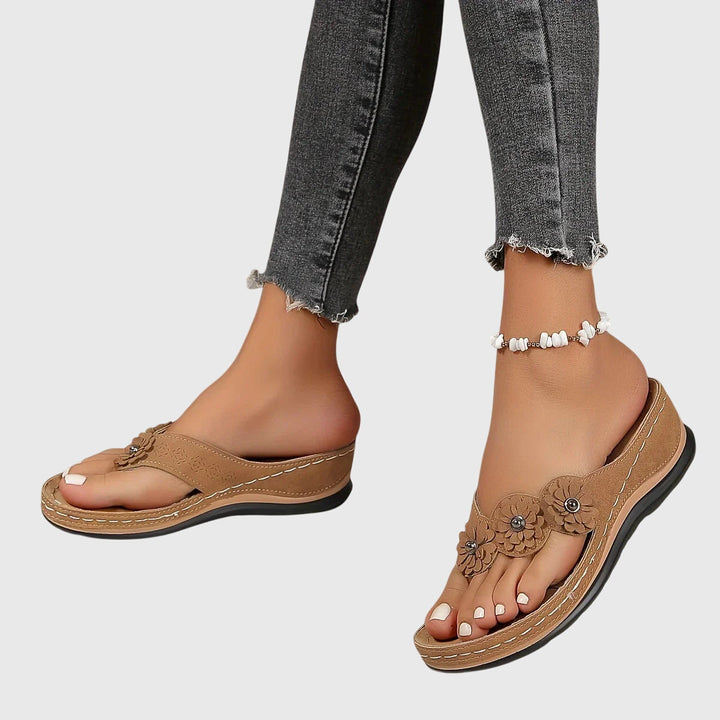 Comfortable women's orthopedic flip flops for arch support, shock absorption & all-day wear.