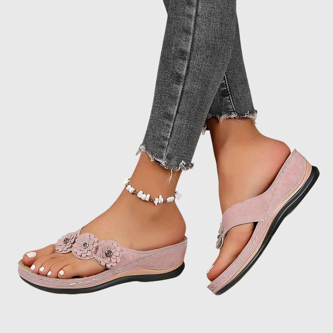 Stylish women's orthopedic flip flops with arch support for ultimate comfort & foot stability.
