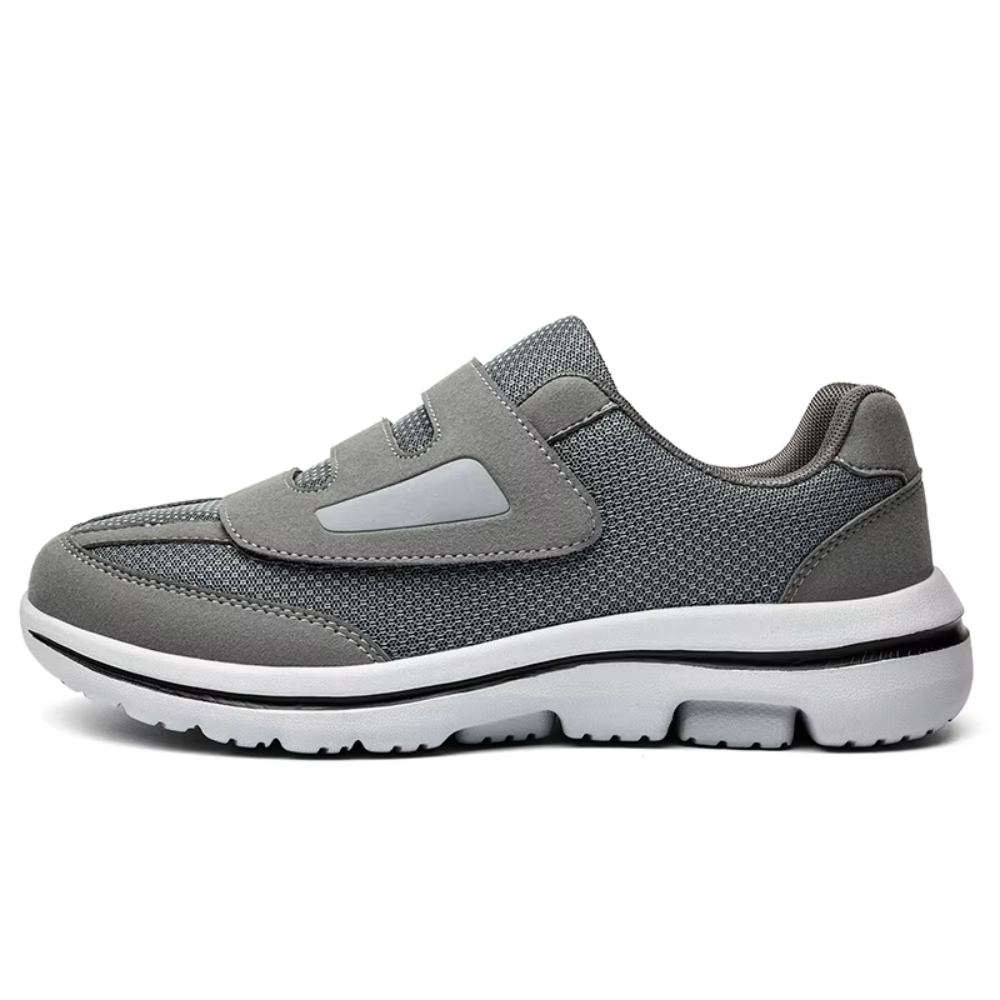 Women's orthopedic grey mesh slip-on shoes with adjustable velcro closure for wide feet.