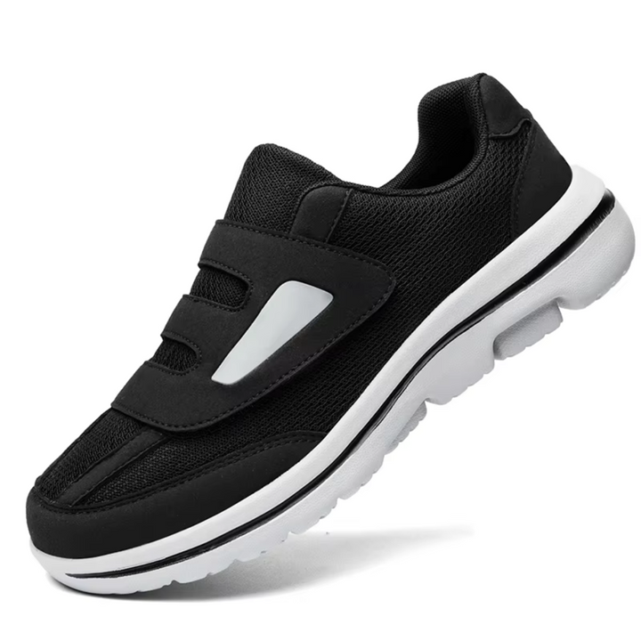 Slip-on women's walking shoes, wide-fit, with adjustable velcro & breathable mesh design.