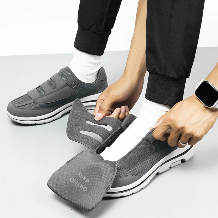 Supportive women's slip-on shoes, wide-fit, adjustable velcro, designed for foot comfort.