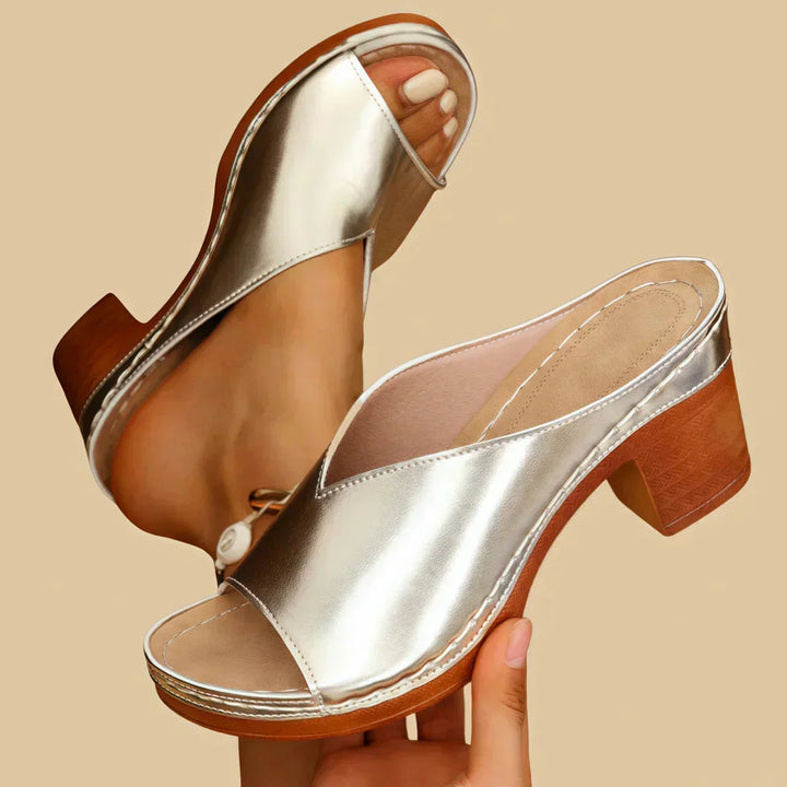 Women's orthopedic heeled sandal with thick supportive block heel for comfort & posture support.