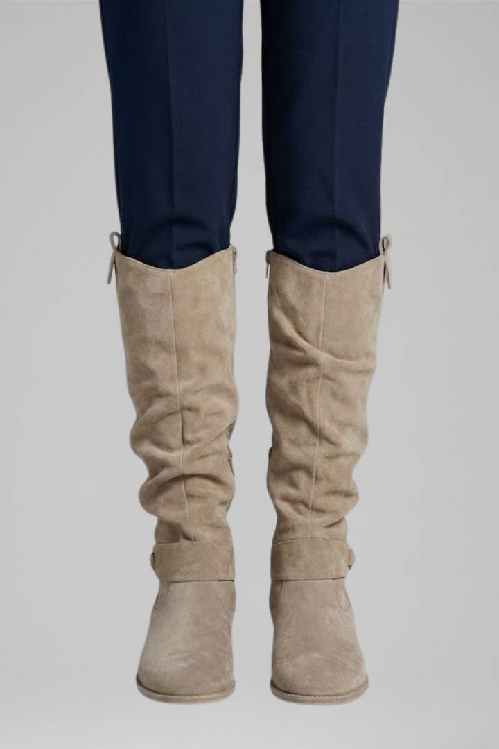 Stylish women's knee-high orthopedic boots with side zip, perfect for casual fall and winter outfits.
