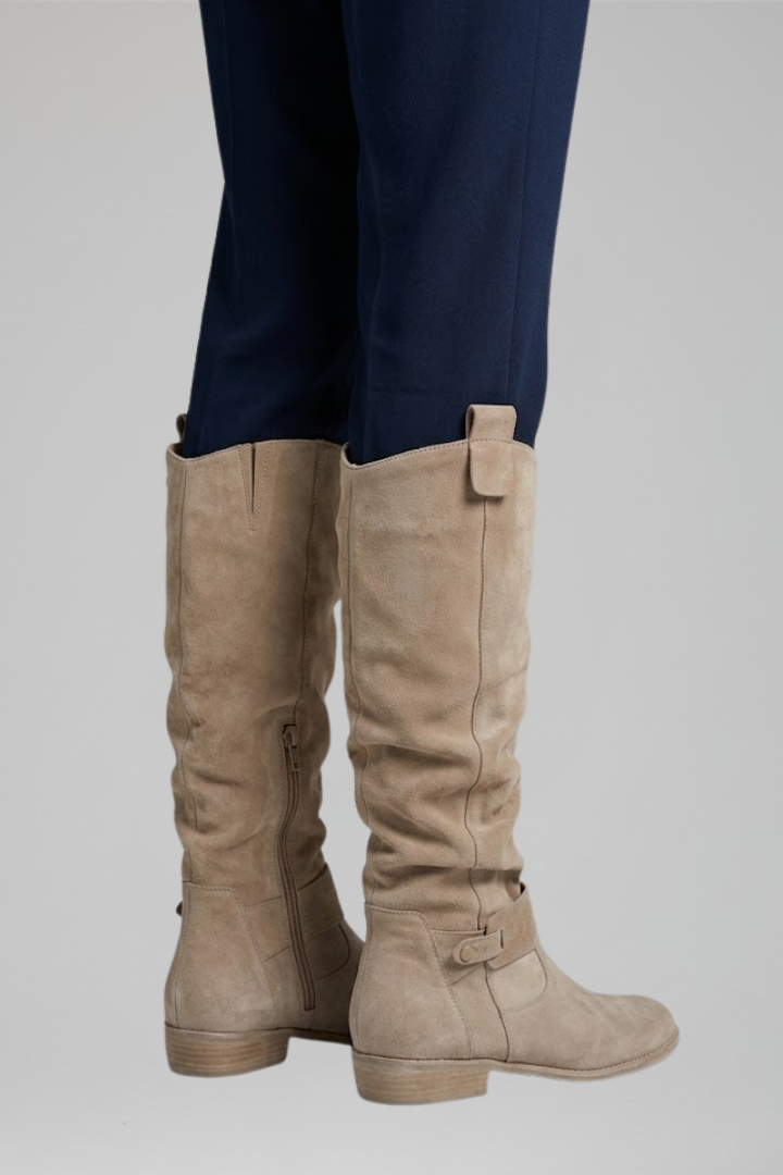 Supportive orthopedic women's knee-high boots with a practical side zip, designed for all-day comfort.