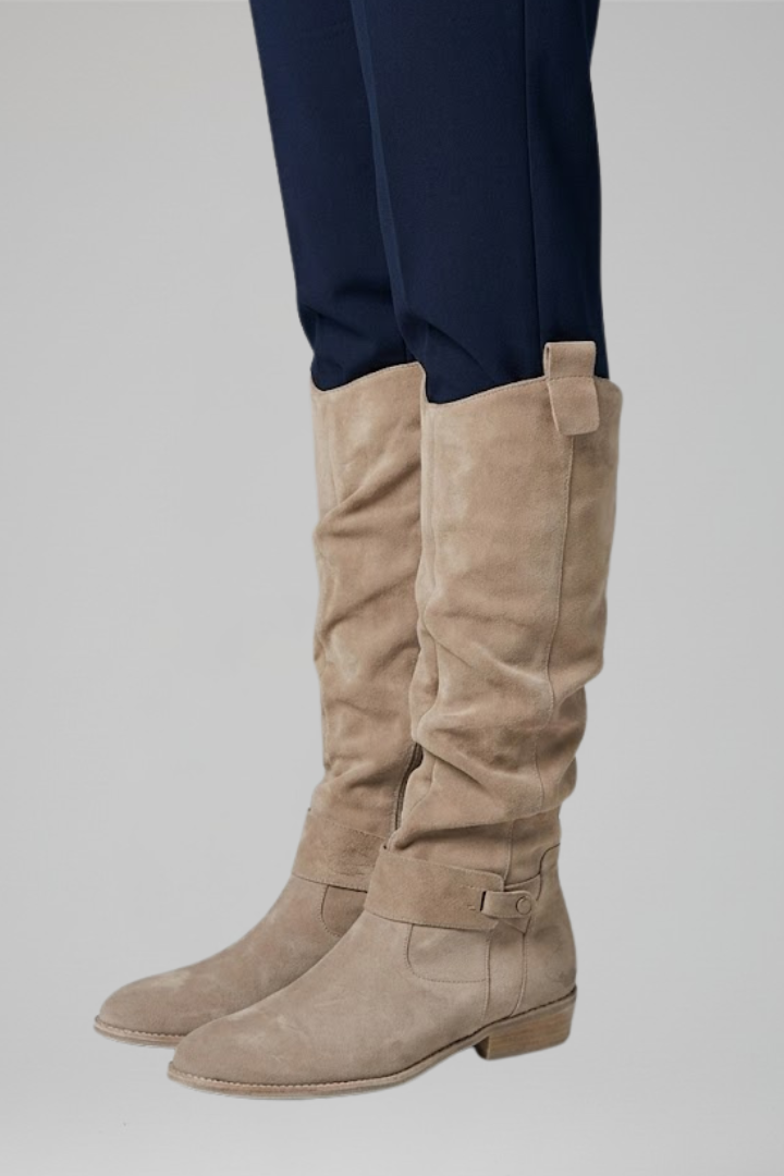 Durable women's orthopedic knee-high boots with a sleek side zipper, offering comfort & style.