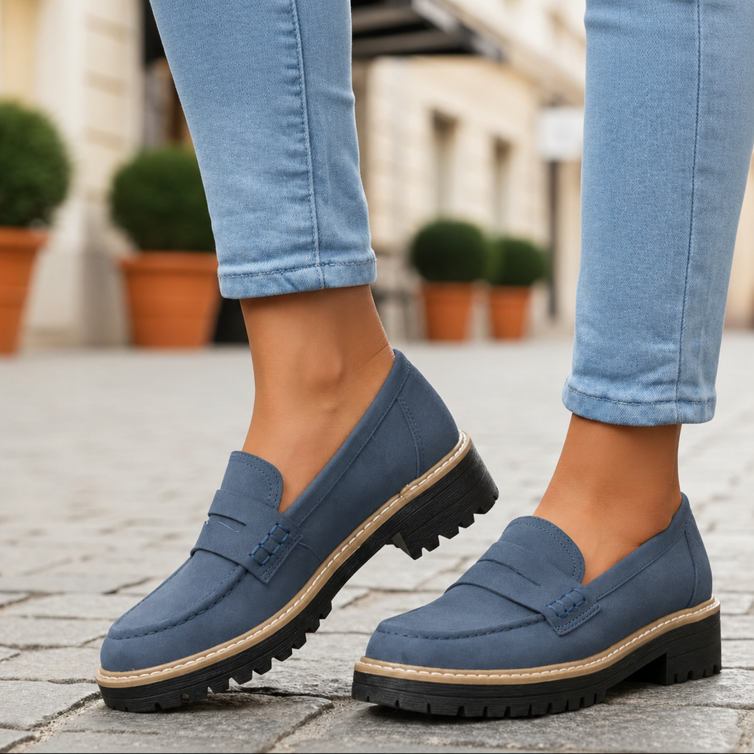 Professional woman wearing stylish orthopedic loafers, blending cushioned comfort with office attire.