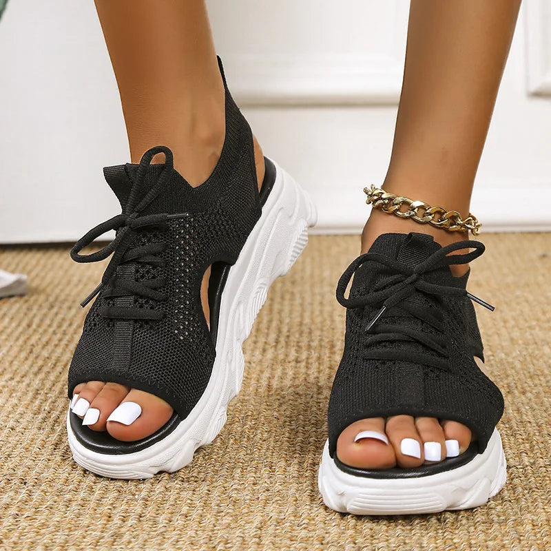Women's orthopedic sandals with adjustable straps, arch support & cushioned sole for comfort.