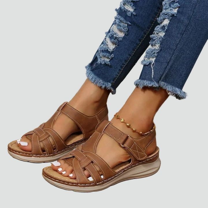 Women's orthopedic sandals with adjustable Velcro straps, offering arch support for comfortable daily wear.