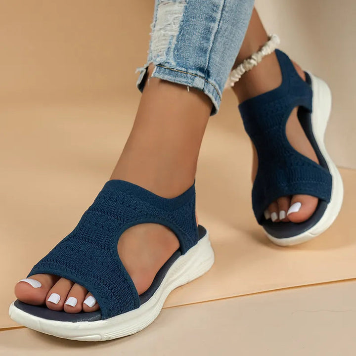 Pair of women's orthopedic sandals, featuring arch support, cushioning, and comfortable design.