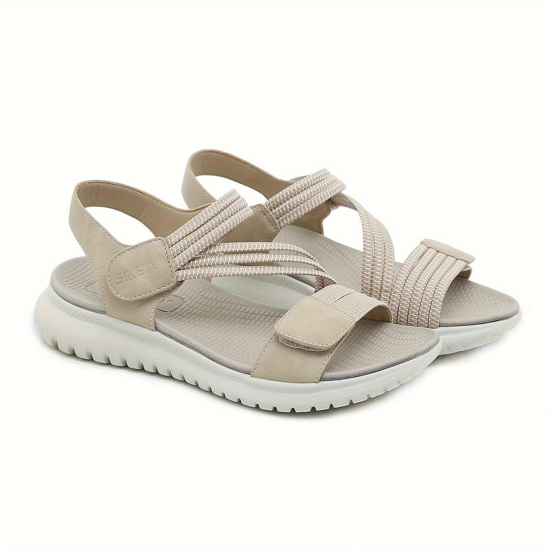 Stylish black orthopedic sandals for women, providing arch support and plantar fasciitis relief.