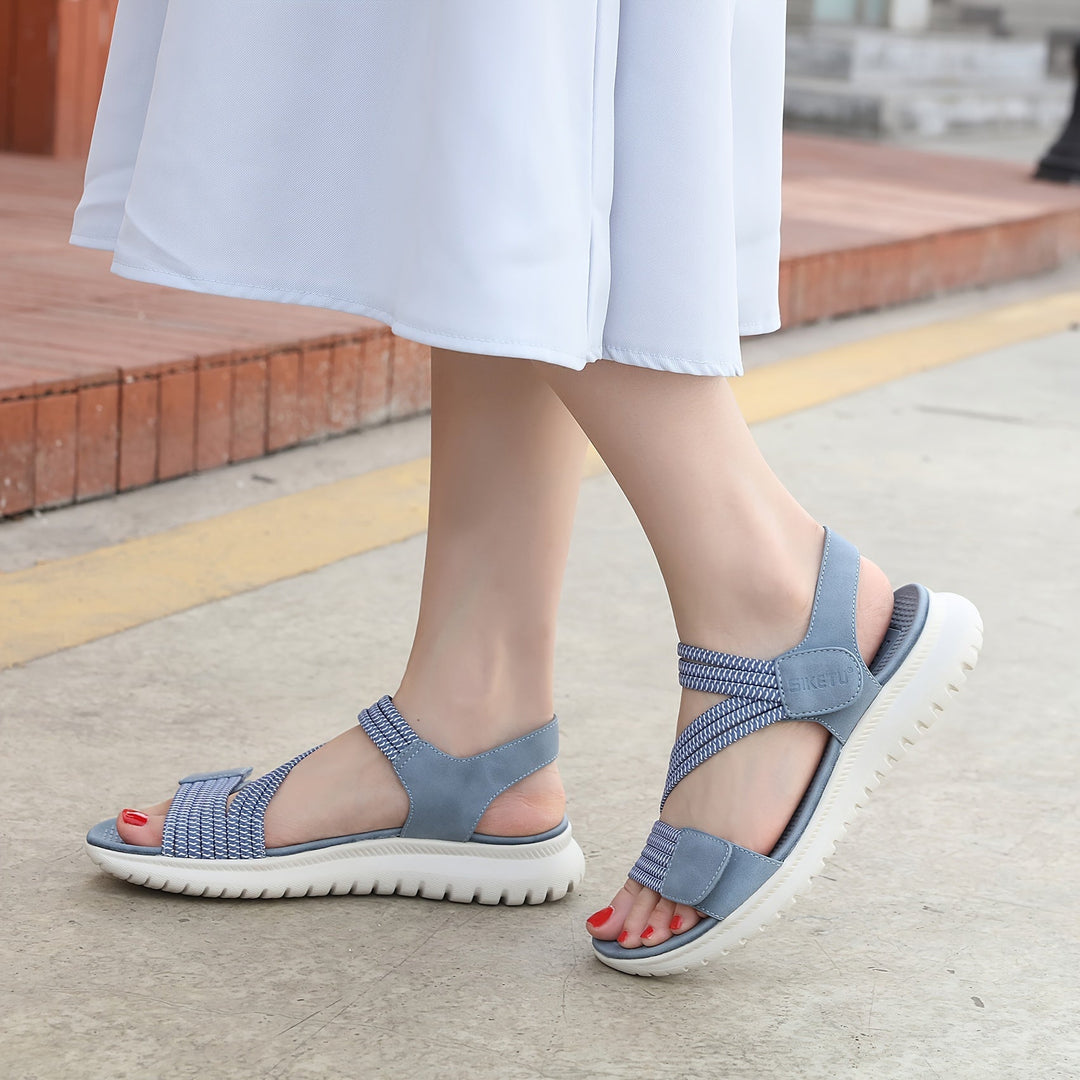 Blue women's supportive sandals with arch support, great for plantar fasciitis & summer foot pain relief.