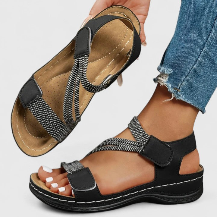 Model wearing women's orthopedic sandals, demonstrating style, comfort, and foot health benefits.