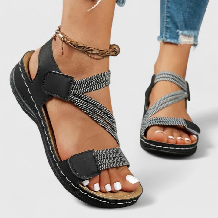 Close-up of the women's sandal's soft footbed and three-arch support technology for ultimate comfort.