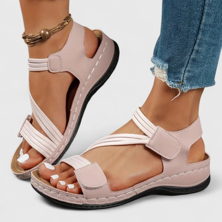 Black women's orthopedic sandals with adjustable straps, ideal for summer walks and foot support.