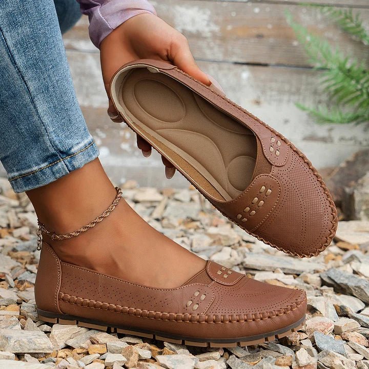 Comfortable women's casual loafers with orthopedic support and perforated details.