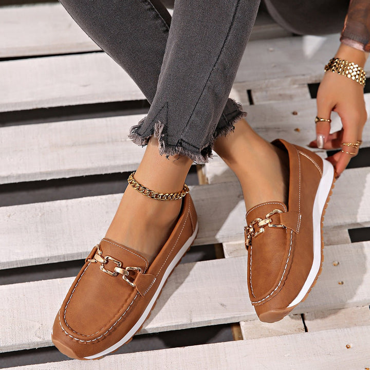 Ultra-comfortable women's orthopedic loafers, slip-on style, with essential arch support.