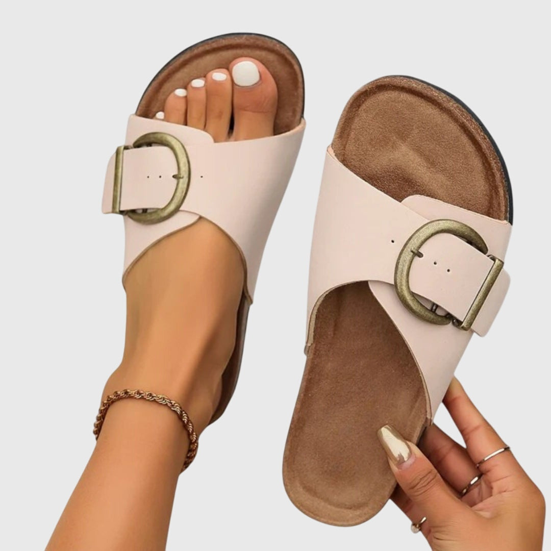 Elegant women's slip-on comfort sandals featuring an adjustable strap and non-slip sole for versatile wear.