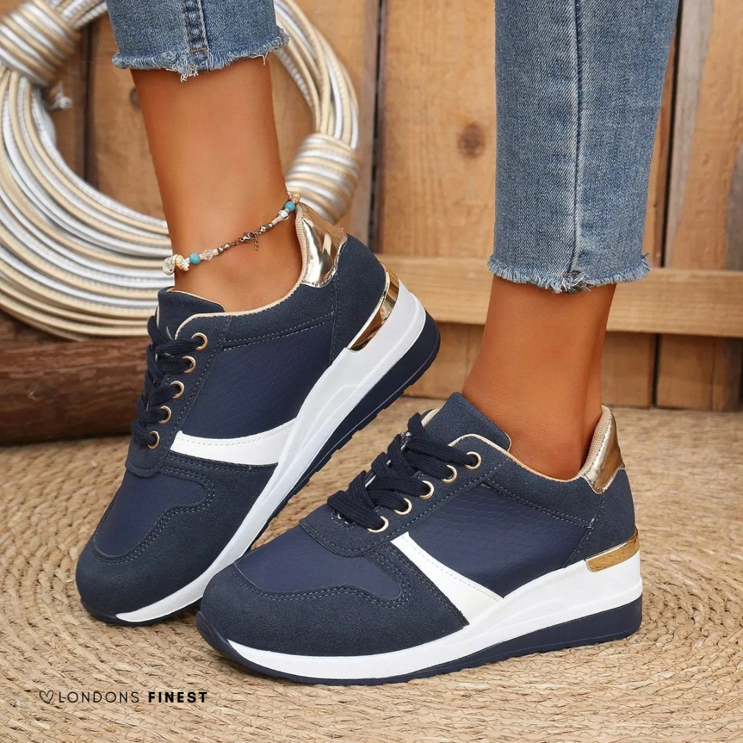 Close-up of women's orthopedic sneakers showing breathable fabric & shock-absorbing cushioned sole for all-day comfort.