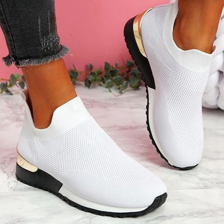 Orthopedic women's sneakers providing posture support and pain relief for active lifestyles.