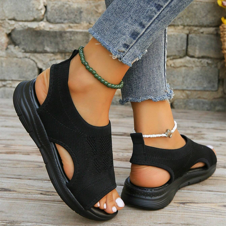 Orthopedic women's sandals, adjustable straps, non-slip for secure walking.