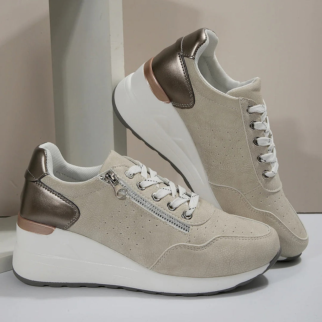 Close-up of women's orthopedic walking shoe sole, highlighting arch support & pain-relieving design.