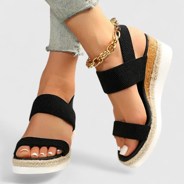 Stylish women's open-toe wedge sandals, perfect for casual summer wear & all-day comfort.