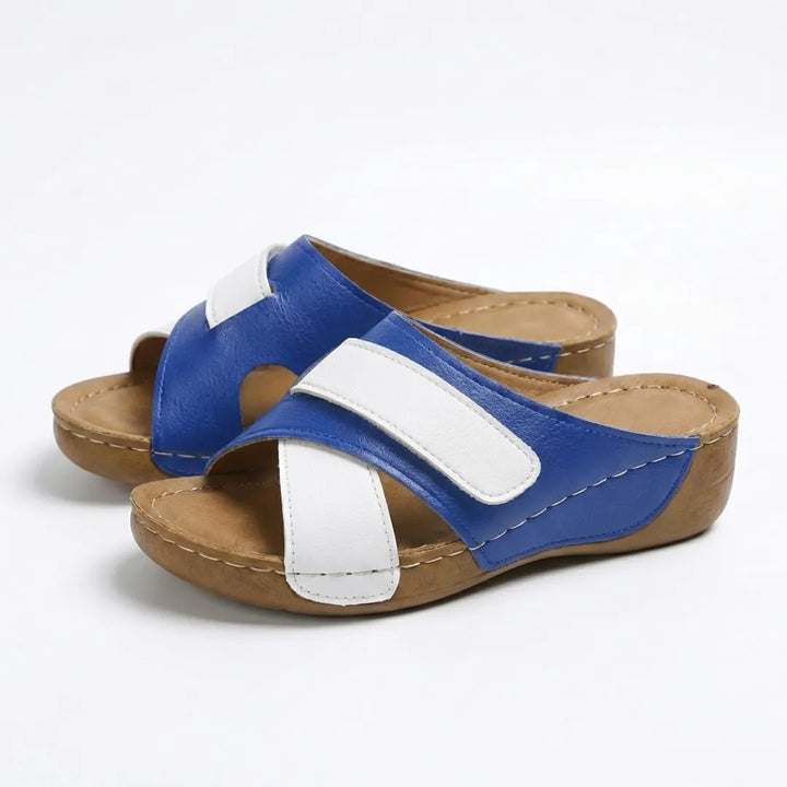 Red women's casual wedge sandals, featuring orthopedic support and an adjustable strap.