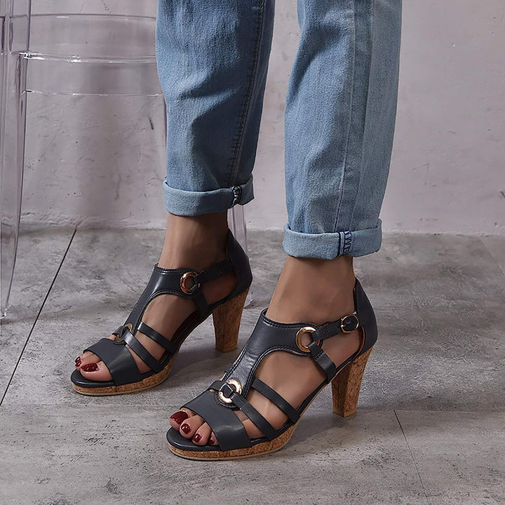 Close-up of the sole of a women's orthopedic wedge sandal, showing arch support technology.