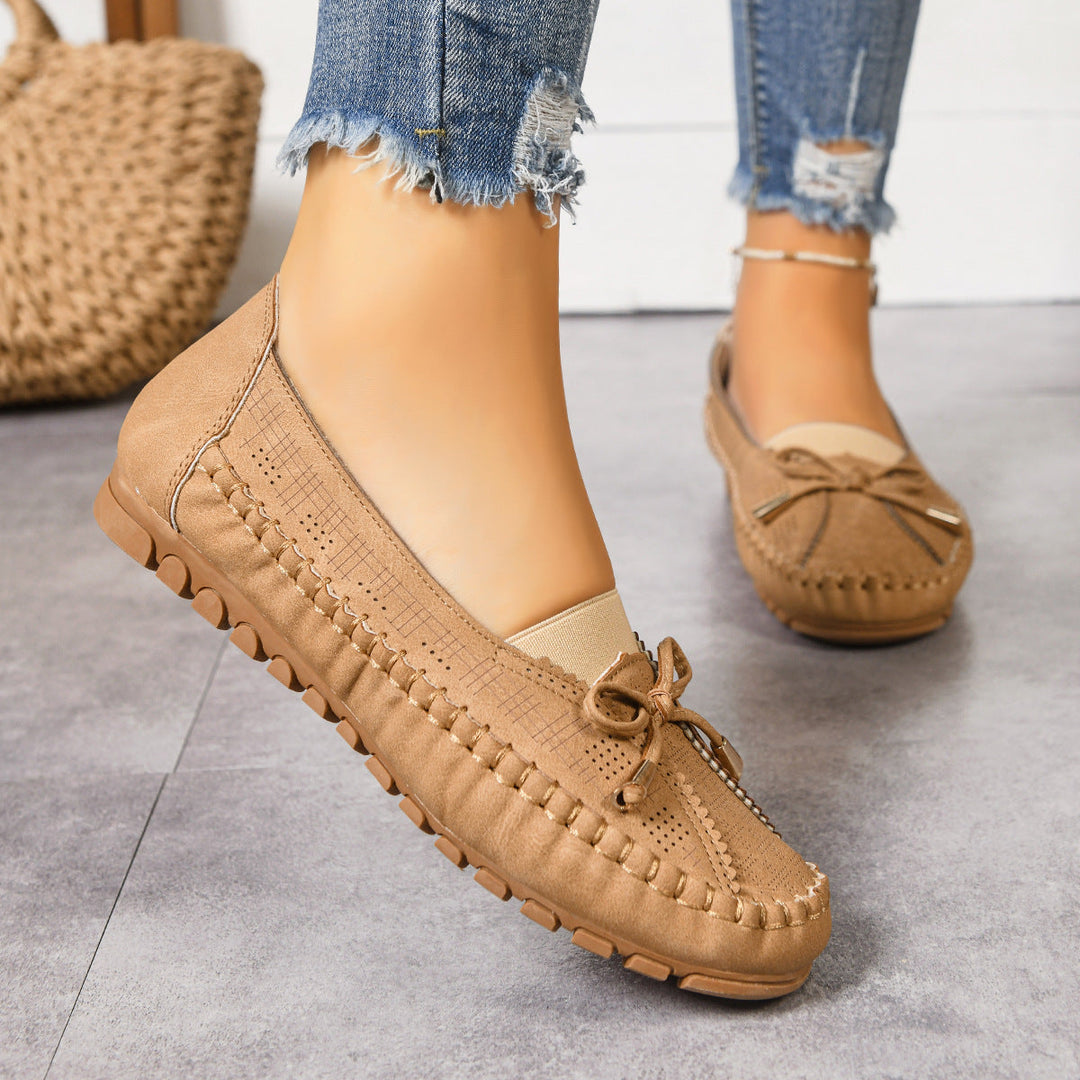 Stylish women's wide fit slip-on loafers, perfect for cushioned all-day comfort & foot support.
