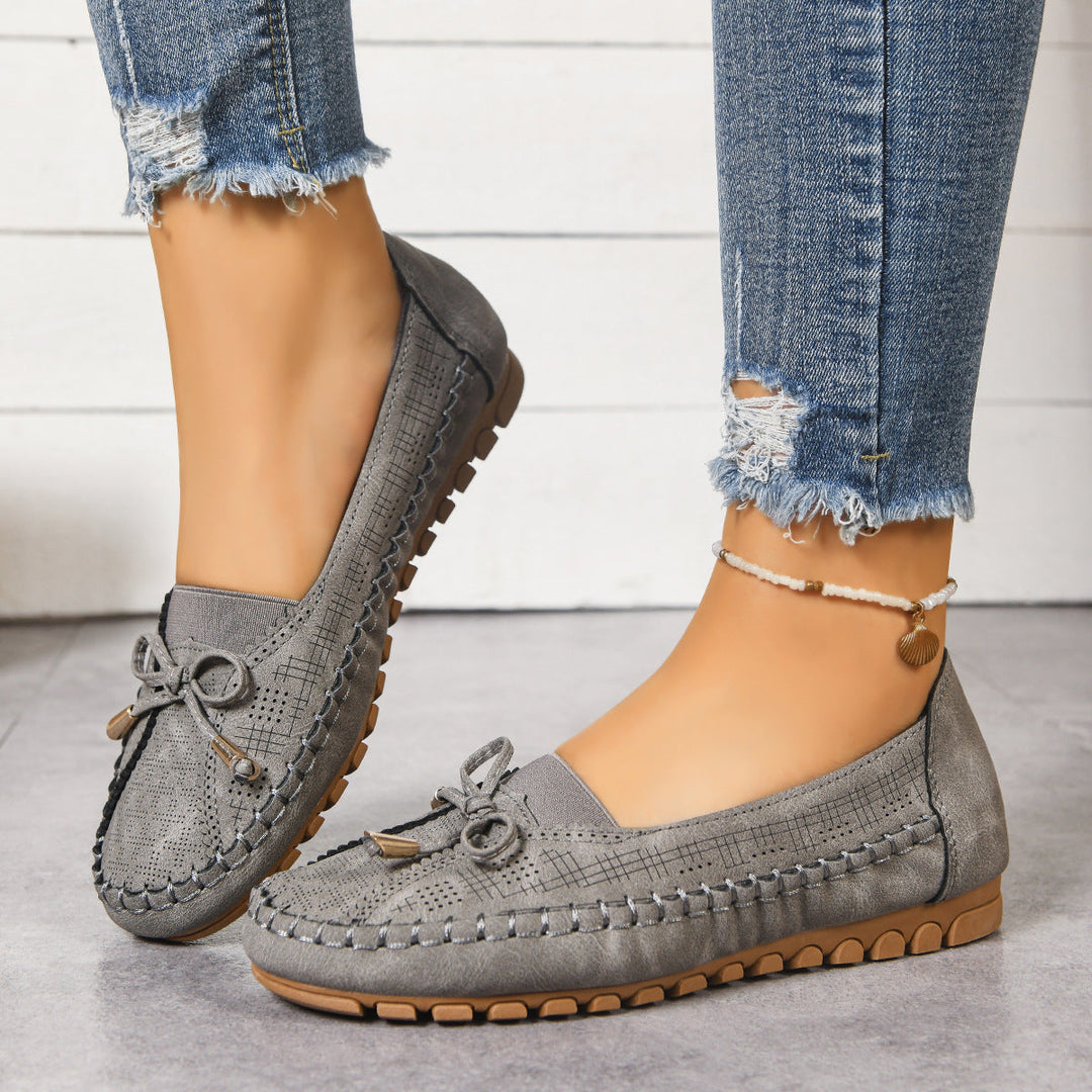 Women's wide fit slip-on orthopedic loafers providing cushioned support and all-day comfort.