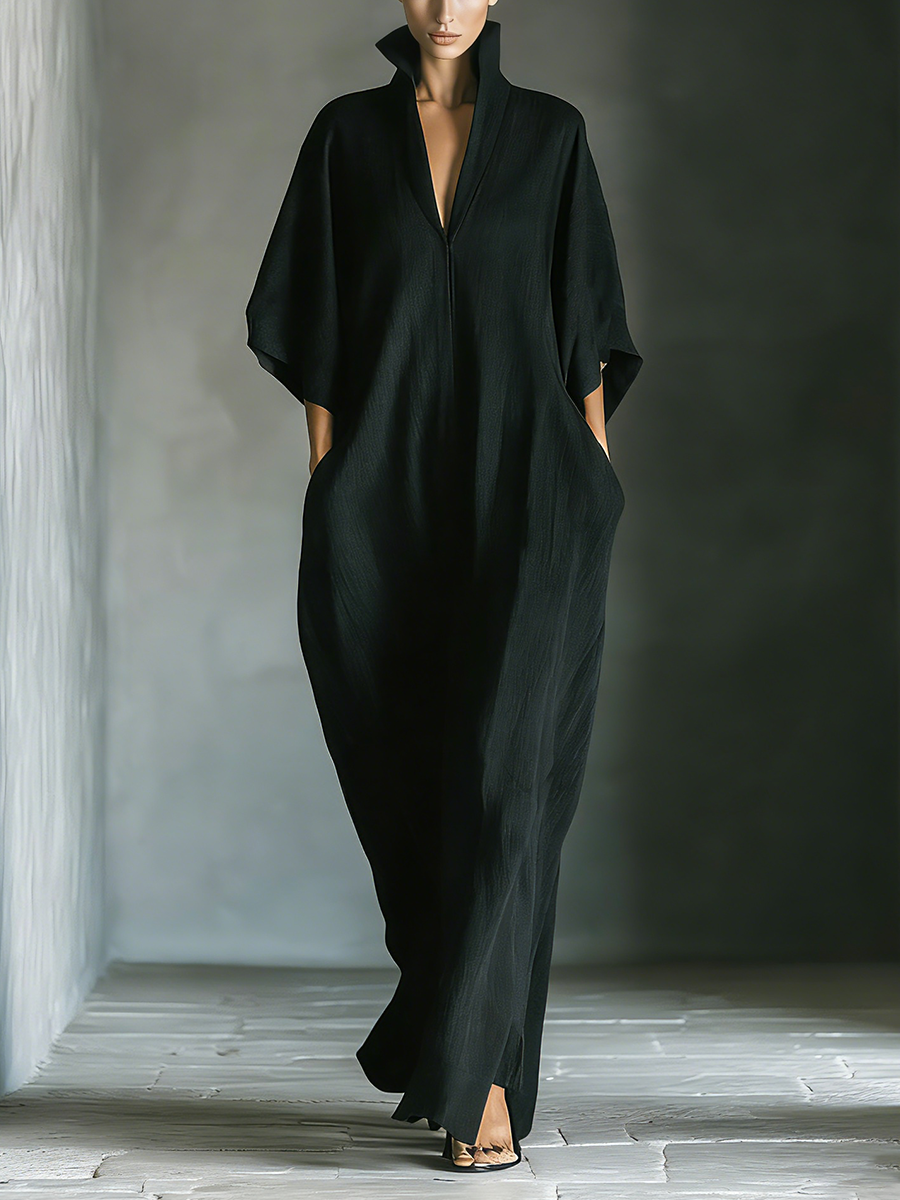 Women's oversized black kimono sleeve maxi dress with pockets, ideal for casual wear.