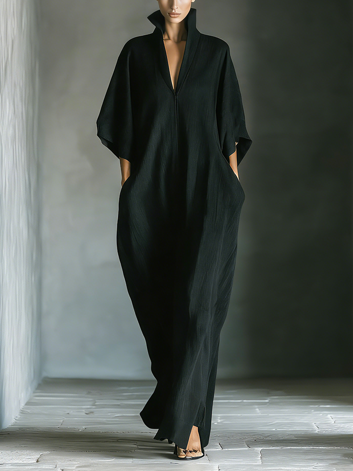 Women's oversized black kimono sleeve maxi dress with pockets, ideal for casual wear.