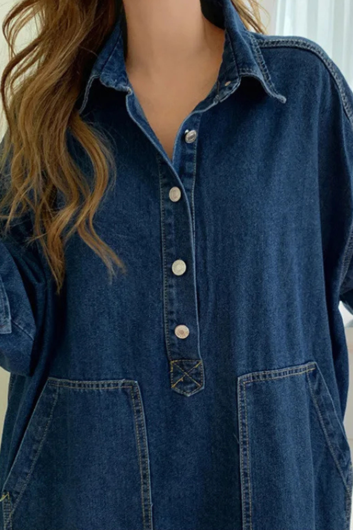Relaxed fit women's oversized maxi shirt dress in blue. Features button front, long sleeves, and practical pockets.