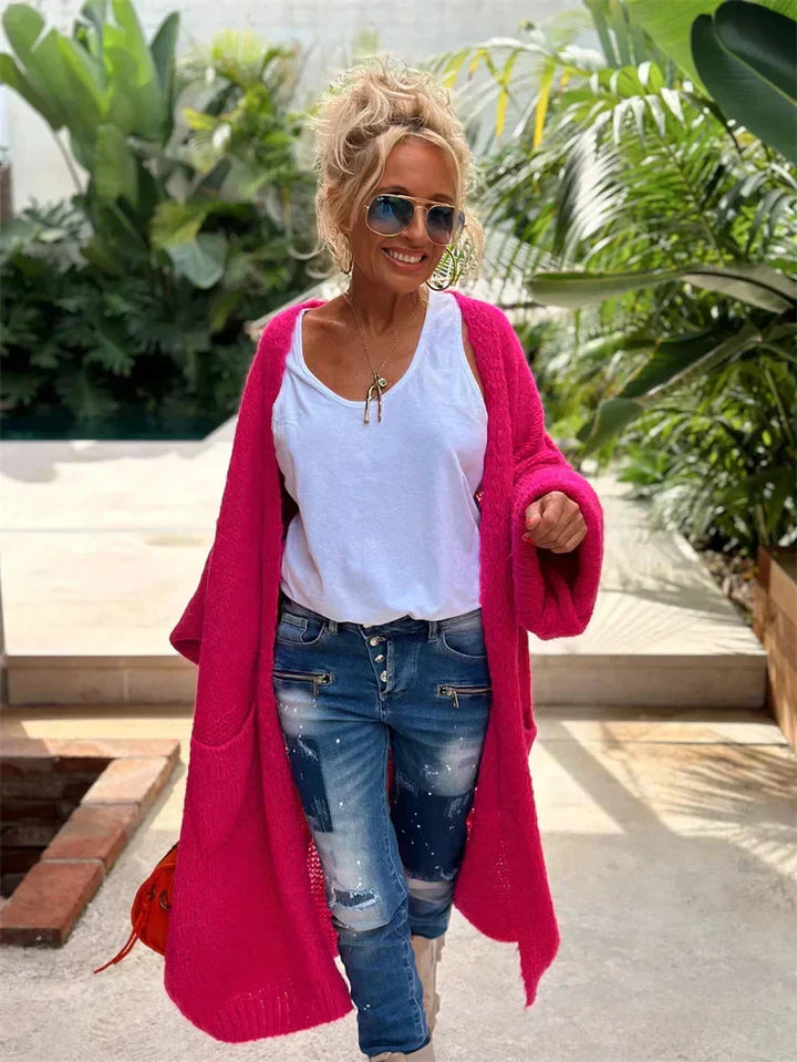 Long bohemian Faye knit cardigan, oversized with vibrant colors & peace symbol details.