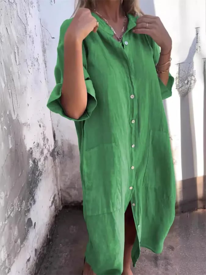 Front view of women's relaxed fit button-down shirt dress with functional pockets. Versatile summer midi.