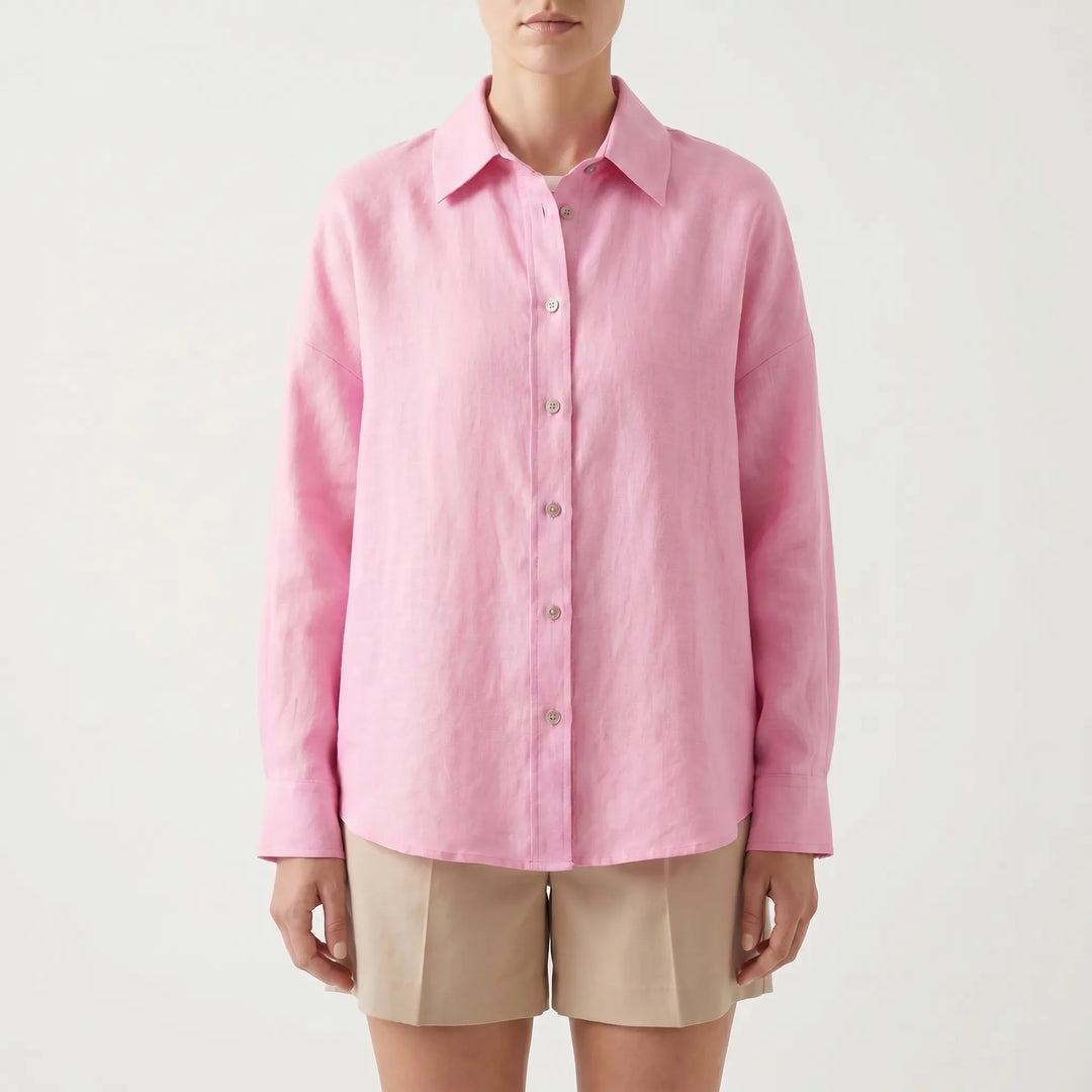 Woman wearing a chic oversized button-down shirt with jeans, ideal for a relaxed summer or everyday style.