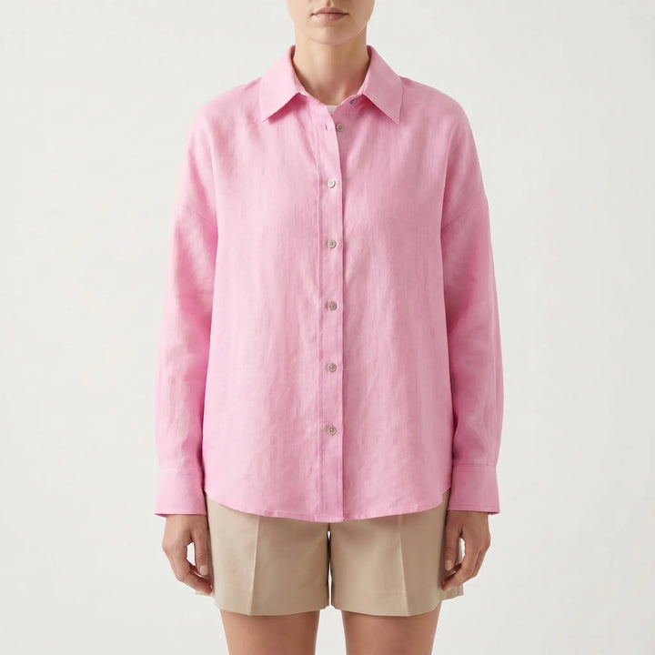 Woman wearing a chic oversized button-down shirt with jeans, ideal for a relaxed summer or everyday style.