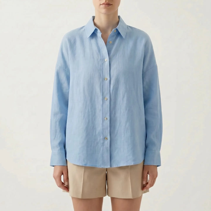Rear view of a versatile women's oversized button-down shirt, highlighting its relaxed fit and long sleeve design.