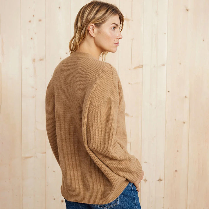 Cozy women's oversized button-up cardigan, a must-have layering piece for casual fall fashion.