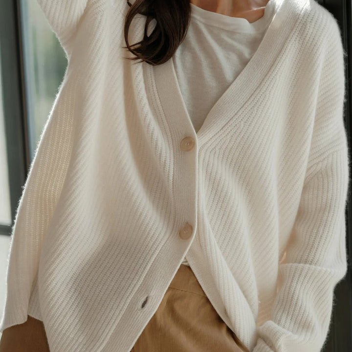 Elegant women's oversized button-up V-neck cardigan, offering casual style and comfort.