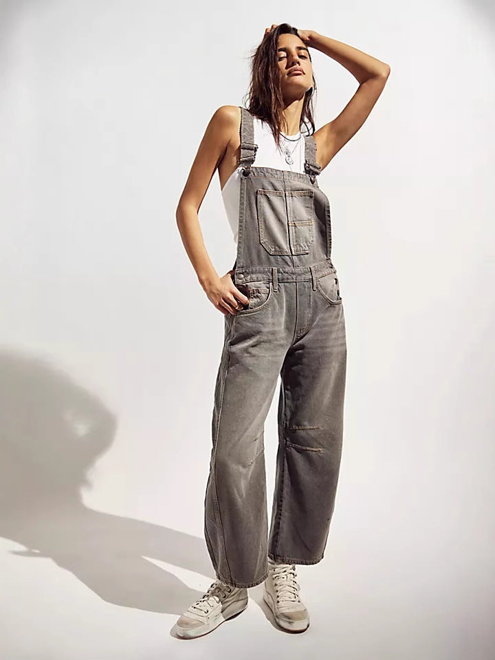Comfortable women's oversized denim jumpsuit with practical pockets, ideal for relaxed everyday wear & streetwear style.