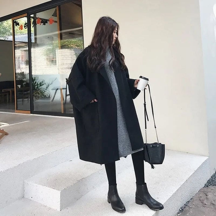 Stylish women's long oversized trench coat, elegant and classic for fall fashion.