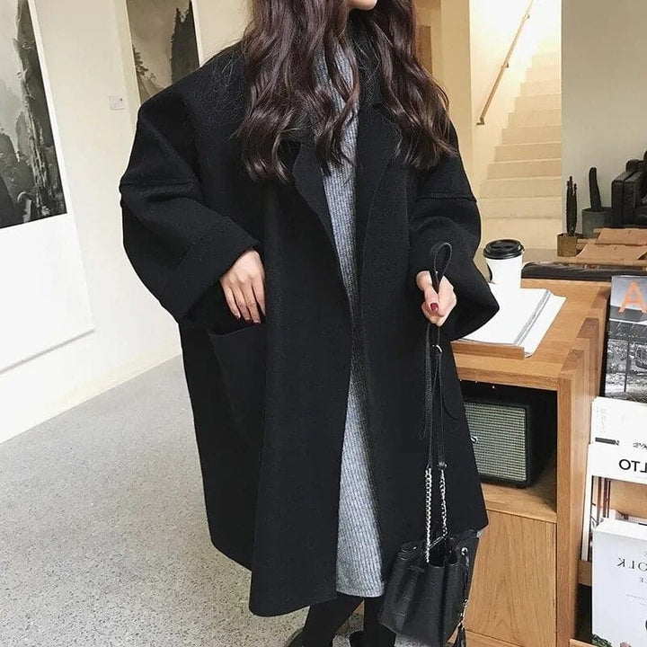 Oversized women's trench coat, classic & elegant for business casual fall outerwear.
