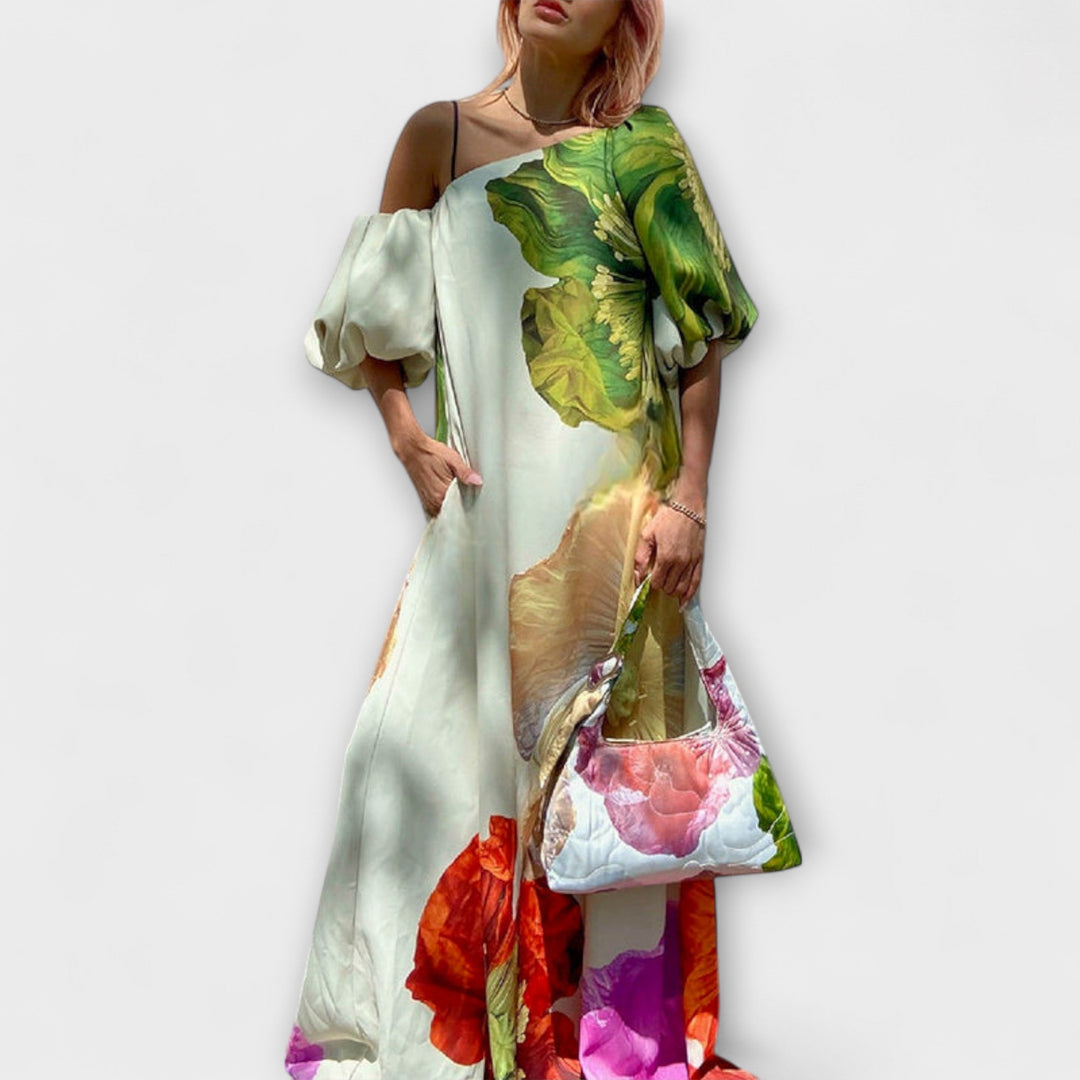 Women's oversized floral off-shoulder maxi dress with elegant puff sleeves. Perfect flowy summer or vacation dress.